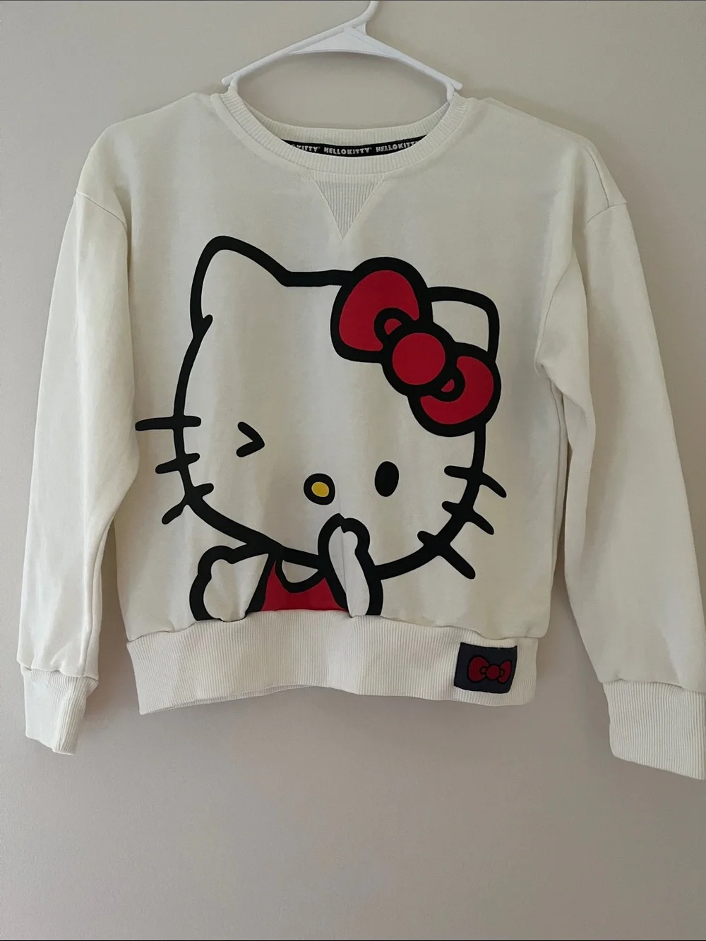 Hello Kitty Cream Sweatshirt with Red Bow Accent
